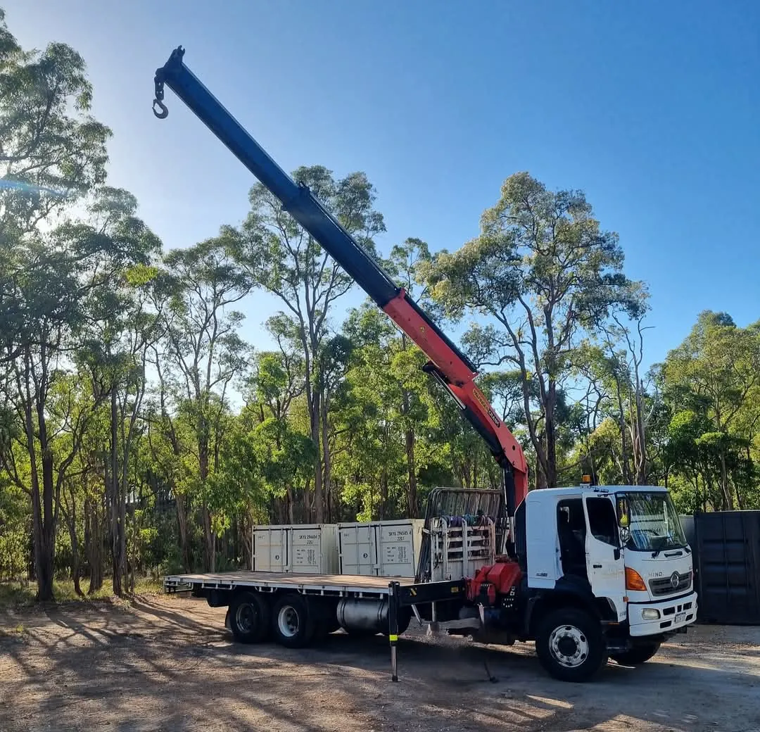 Hino crane truck with HIAB crane extended, on site in Western Australia