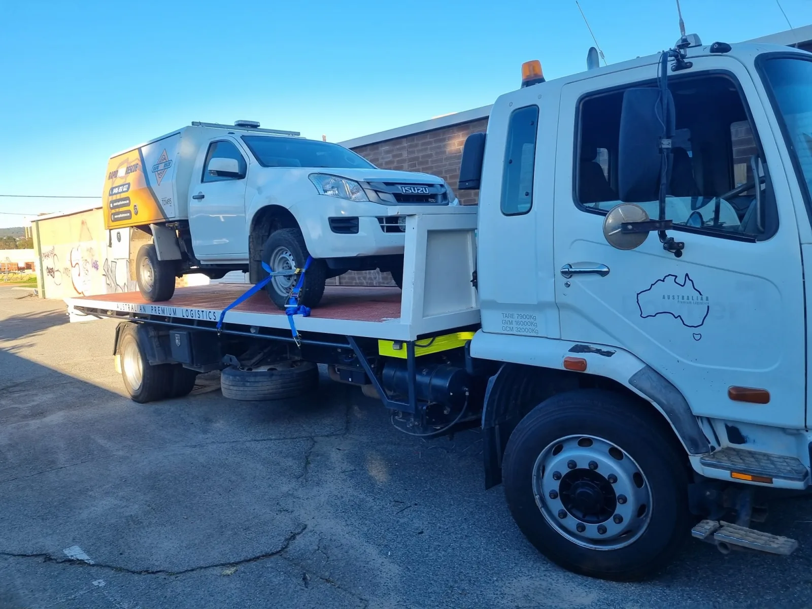 Australian Premium Logistics tilt tray truck loaded with a ute in Perth